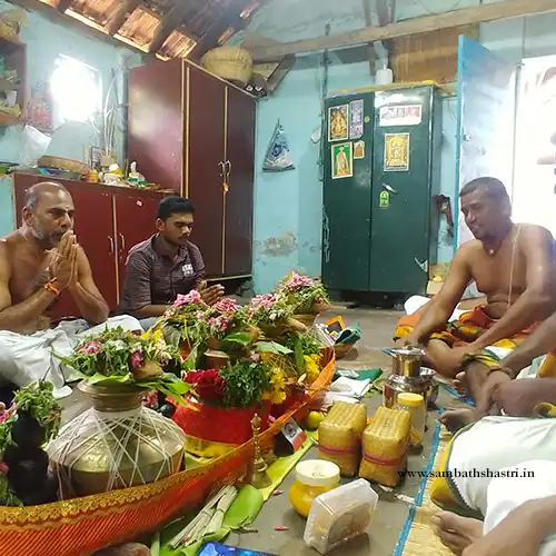 Sambath Sasthri performing a homam with a family